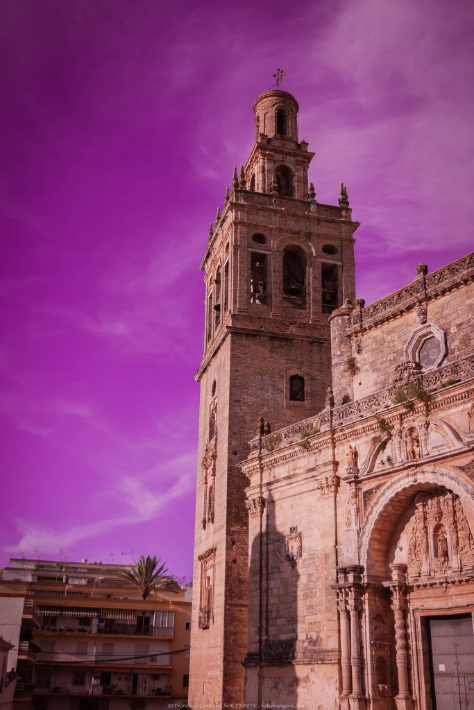 Frontface and belltower of The church of San Miguel Arcángel in Moron de la Frontera Seville Andalusia south of Spain